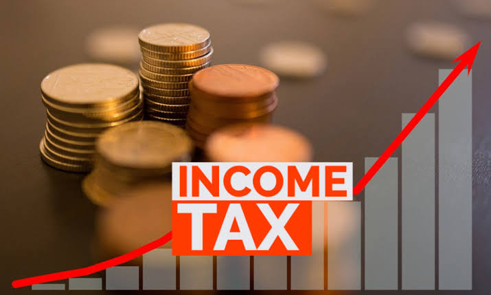 Coins and an upward graph illustrating income tax planning